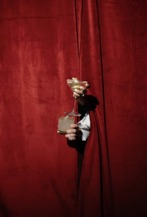 Cocktails passed through a velvet curtain